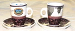 Ola's Exotic Coffee & Tea Two Ceramic Cups Saucers. Fixed Price $9.00.